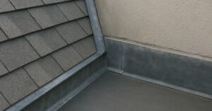 junction between a flat roof and a pitched roof